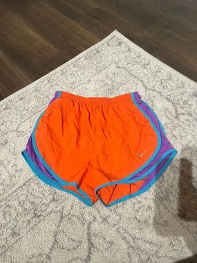 Nike Tempo Orange Running Shorts with Turquoise & Purple Trim